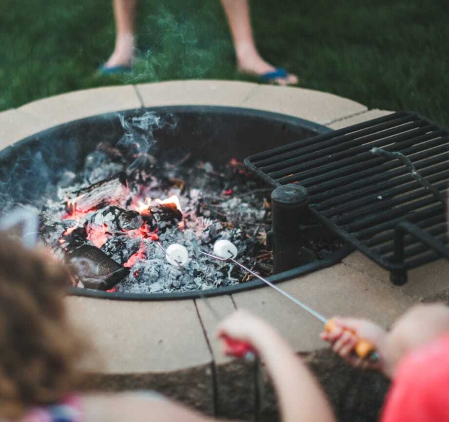 Roasting marshmallows over a fire pit