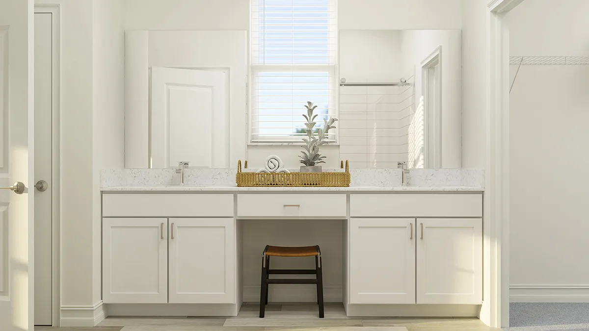 Modern bathroom with white cabinets, double sinks, large mirrors, a window with blinds, a wooden stool under the counter, and a decorative tray with plants on the counter. The space is bright and minimalist.