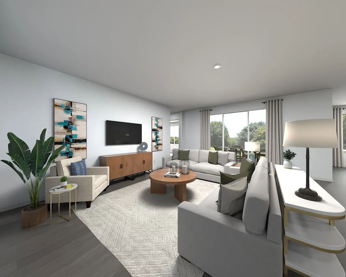 Modern living room with large windows, neutral-colored sofas, a round coffee table, a TV on a wooden console, abstract wall art, indoor plants, and floor-to-ceiling curtains letting in natural light.