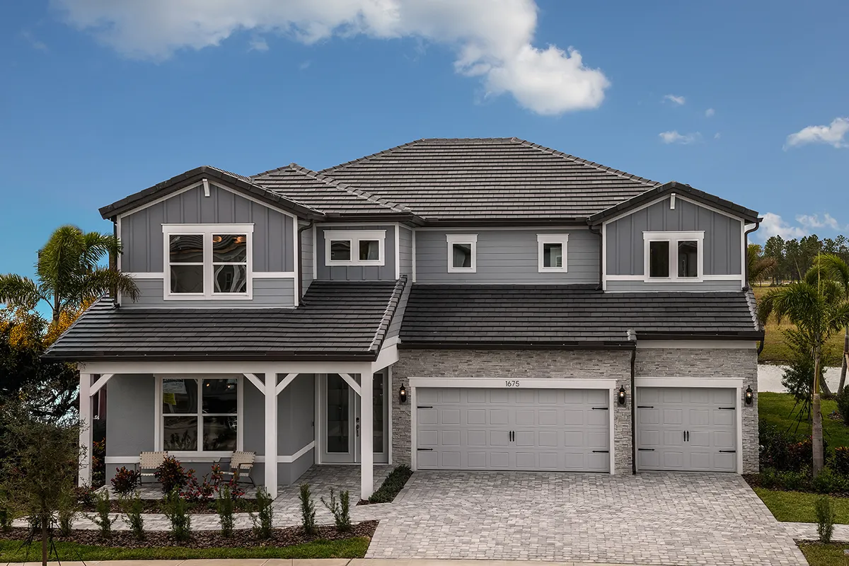 Exterior view of a large two-story home with a three-car garage.