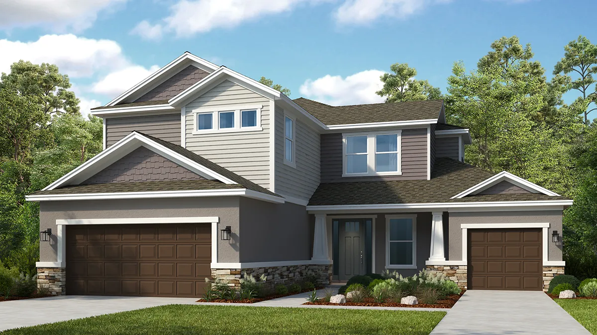 Two-story modern suburban house with gray and beige siding, three separate brown garage doors, a neatly landscaped front yard, and surrounded by green trees under a blue sky with clouds.