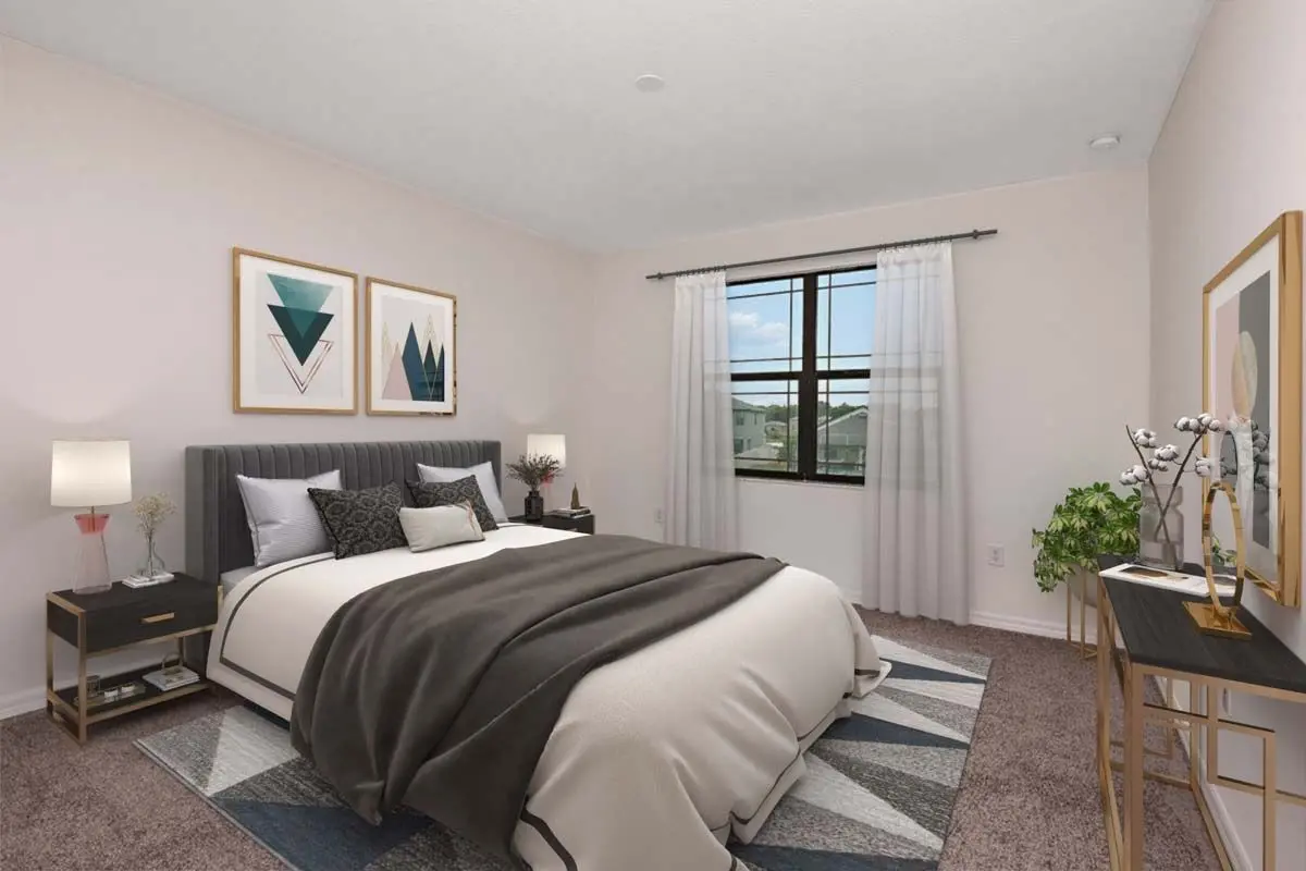 A modern bedroom with a large bed, geometric artwork on the wall, two bedside tables with lamps, a window with sheer curtains, a desk with decor, and a potted plant on a carpeted floor.
