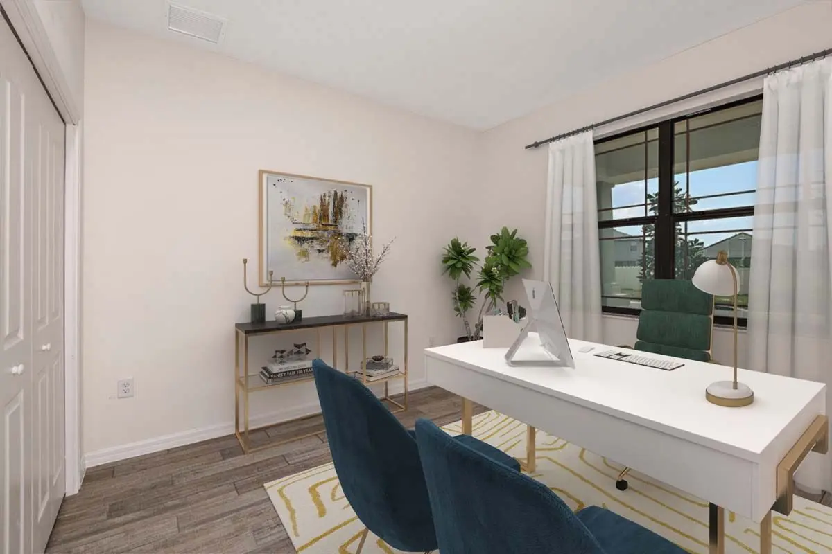 A modern home office with a white desk, green chair, two blue guest chairs, a gold console table with decor, a potted plant, abstract wall art, mauve walls, and a large window with white curtains.