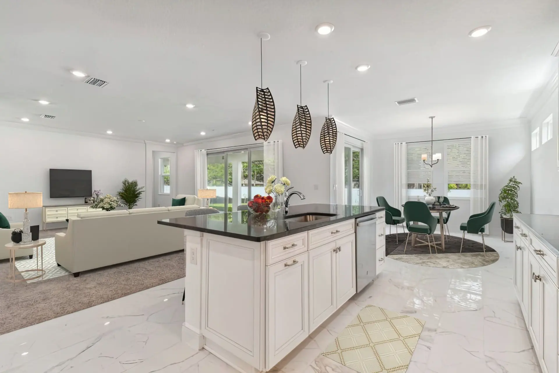 Spacious modern open-concept kitchen and living area with white cabinets, a black countertop island, pendant lights, green dining chairs, and large windows letting in natural light.