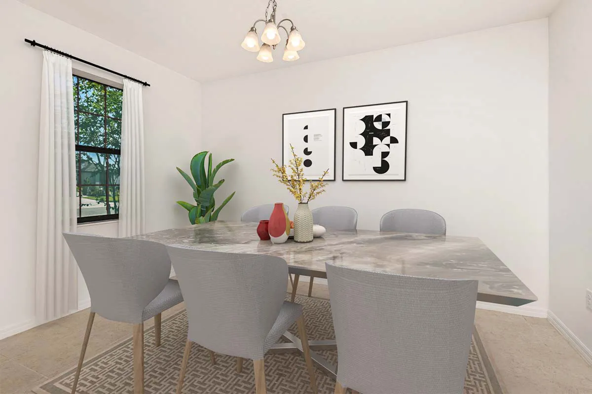 Modern dining room with a marble table, six gray chairs, abstract wall art, a plant by the window, and minimalist decor including vases with yellow flowers and red accents on the table. Natural light enters from the window.
