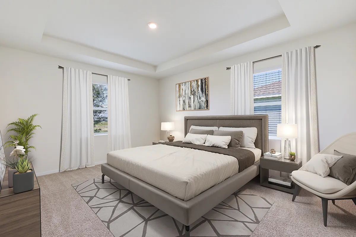 A modern bedroom with a large bed, two windows with white curtains, a geometric rug, bedside tables with lamps, a decorative plant, and a framed artwork above the bed. The room has neutral colors and soft lighting.