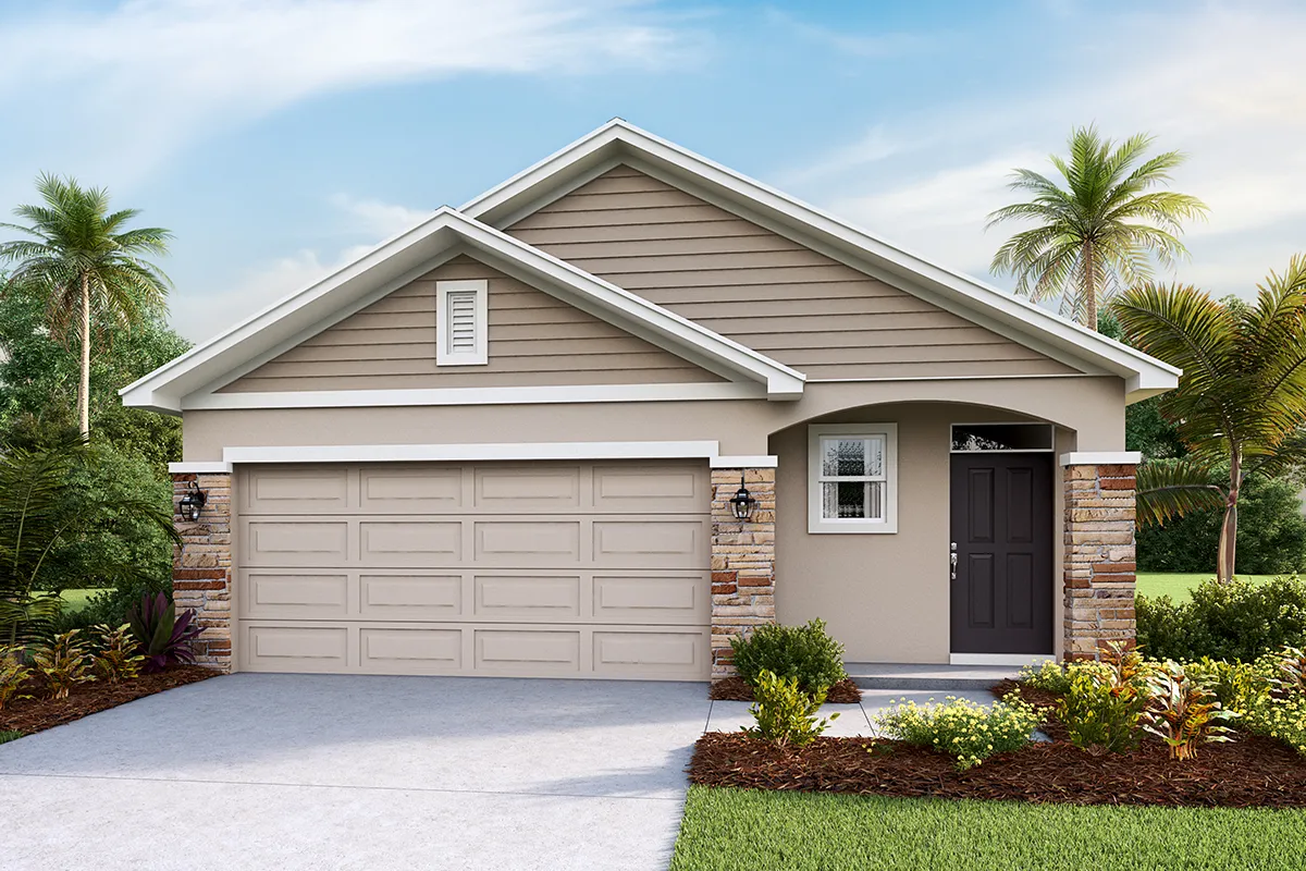 Single-story suburban house with a two-car garage, beige siding, stone accents, and a dark front door. The yard is landscaped with green grass, plants, and palm trees under a partly cloudy sky.