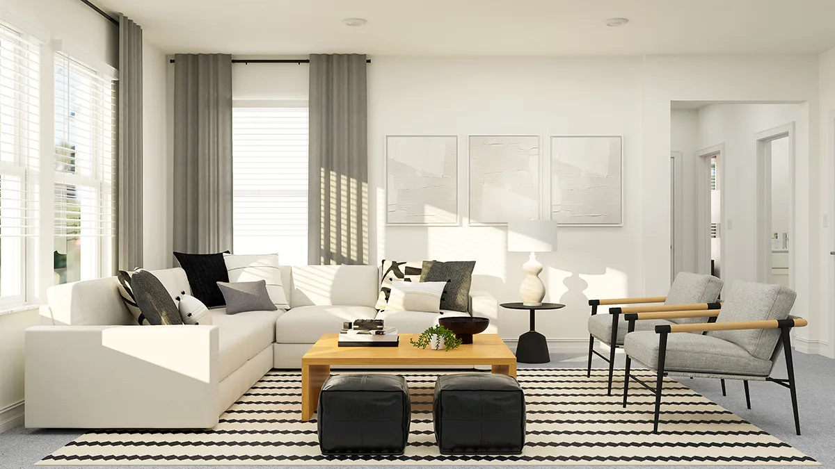 A modern living room with a white sectional sofa, grey armchairs, a wooden coffee table, black ottomans, striped rug, and light grey curtains. Minimalist wall art and decor complete the bright, airy space.