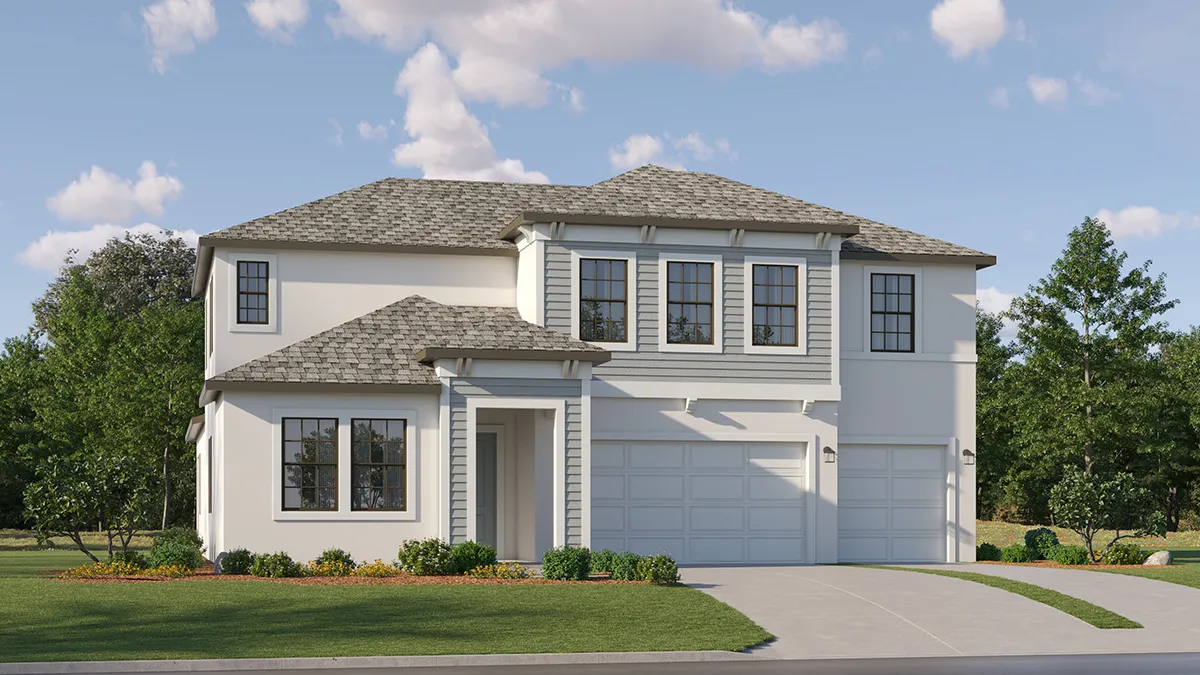 Modern two-story suburban house with light gray siding, white walls, multiple windows, and a three-car garage. The home is surrounded by green grass, small bushes, and trees under a blue sky with scattered clouds.