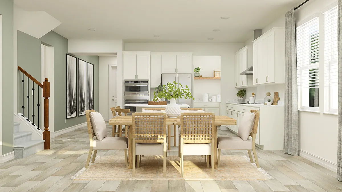 Modern open-concept kitchen and dining area with light wood floors, white cabinets, a wooden dining table with six cushioned chairs, large windows with curtains, and decorative plants on the table.