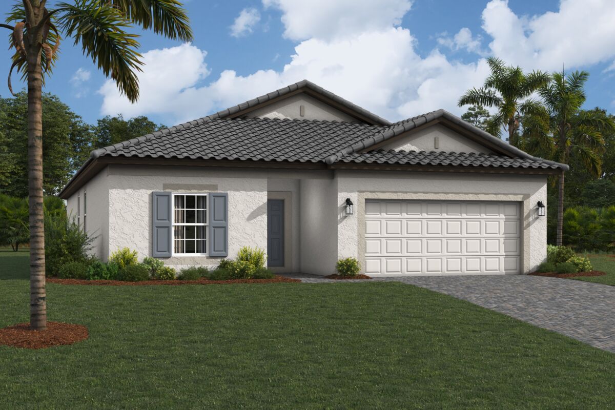 A single-story house with light stucco walls, gray shutters, a gray tiled roof, and a double garage. There is a paved driveway, landscaped bushes, a lawn, and palm trees under a partly cloudy sky.