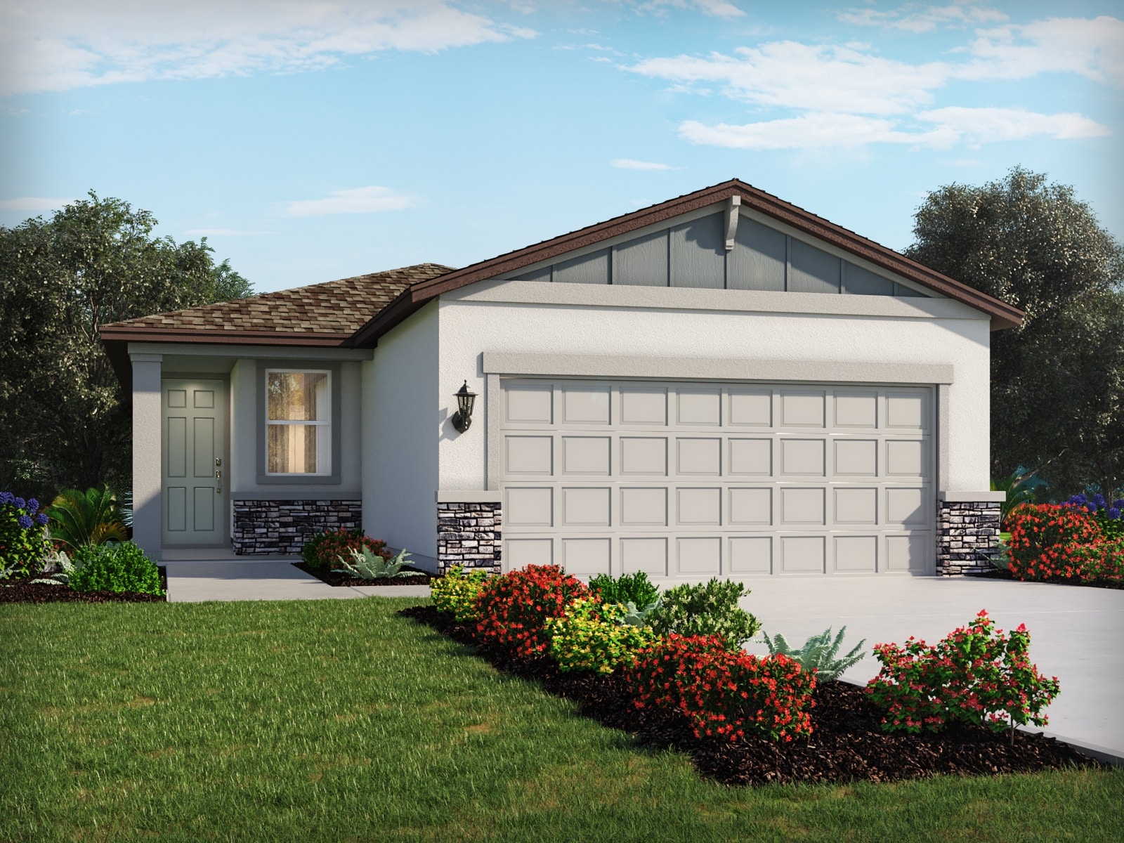 Single-story suburban house with a gray roof, light-colored exterior, double garage, and neatly landscaped front yard featuring green grass, shrubs, and colorful flowers under a partly cloudy sky.